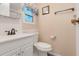 Bathroom featuring white vanity, toilet, and neutral walls at 1401 W Highway 50 # 12, Clermont, FL 34711
