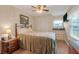 Bedroom with closet, bedside table, and light beige walls at 1401 W Highway 50 # 12, Clermont, FL 34711