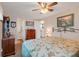 Bedroom with dresser and an entrance to an adjacent bathroom at 1401 W Highway 50 # 12, Clermont, FL 34711