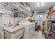 Laundry room with washer, dryer, sink, shelving, and storage at 1401 W Highway 50 # 12, Clermont, FL 34711
