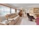 Spacious living room featuring comfortable sofas and chairs, perfect for entertaining guests at 1401 W Highway 50 # 12, Clermont, FL 34711