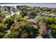Property with waterfront access and mature trees at 1785 Maine Ct, Tavares, FL 32778