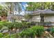 Relaxing backyard with seating area and lush greenery at 1785 Maine Ct, Tavares, FL 32778
