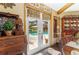 View of backyard pool through French doors from the dining room at 1785 Maine Ct, Tavares, FL 32778