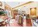 Charming dining room with hardwood floors and view into the kitchen at 1785 Maine Ct, Tavares, FL 32778