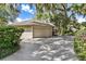 Home with attached garage and manicured landscaping at 1785 Maine Ct, Tavares, FL 32778