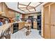 Bright kitchen with wood cabinets and skylight at 1785 Maine Ct, Tavares, FL 32778