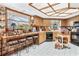 Cozy kitchen with wood cabinets and breakfast bar at 1785 Maine Ct, Tavares, FL 32778