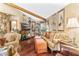 Living room with hardwood floors, comfortable furniture and large windows at 1785 Maine Ct, Tavares, FL 32778
