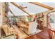 Bright living room with hardwood floors, comfortable seating, and large windows at 1785 Maine Ct, Tavares, FL 32778