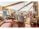 Large living room with hardwood floors, high ceilings, and exposed beams at 1785 Maine Ct, Tavares, FL 32778