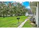 Backyard with grassy area, trees, and a grill at 10301 Us Highway 27 # 178, Clermont, FL 34711