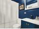 Modern bathroom with navy blue walls, white vanity, and updated fixtures at 10301 Us Highway 27 # 178, Clermont, FL 34711