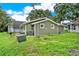 Exterior view of the house, showcasing green siding and landscaping at 10301 Us Highway 27 # 178, Clermont, FL 34711