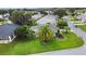 Aerial view of home with well-maintained lawn, mature landscaping and desirable neighborhood features at 1902 Rosario Rd, Lady Lake, FL 32159