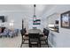 Dining area with table and chairs, chandelier, and view to the kitchen at 1902 Rosario Rd, Lady Lake, FL 32159