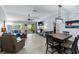 Bright living room featuring tile flooring, comfortable furniture, and sliding glass doors to the patio at 1902 Rosario Rd, Lady Lake, FL 32159