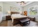 Spacious bedroom with wood flooring and a king-size bed at 38905 Harborwoods Pl, Lady Lake, FL 32159