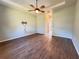 Spacious bedroom with hardwood floors and ceiling fan at 38905 Harborwoods Pl, Lady Lake, FL 32159