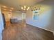 Bright dining room with chandelier and wood floors at 38905 Harborwoods Pl, Lady Lake, FL 32159