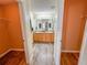 Double vanity bathroom with wood cabinets and a shower at 1101 Blythe Way, The Villages, FL 32162