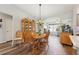 Bright dining area with a wooden table and chairs, near kitchen at 1101 Blythe Way, The Villages, FL 32162