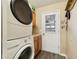 Laundry room with washer, dryer, and access to garage at 1101 Blythe Way, The Villages, FL 32162