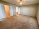 Large bedroom with ample closet space and carpet at 1660 Elkhart Cir, Tavares, FL 32778