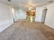 Spacious living room with carpeted floors and neutral walls at 1660 Elkhart Cir, Tavares, FL 32778