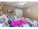 Spacious bedroom with a TV and comfortable bedding at 21835 King Henry Ave, Leesburg, FL 34748