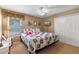 Spacious bedroom with nautical-themed bedding and double doors at 21835 King Henry Ave, Leesburg, FL 34748