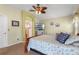 Primary bedroom with ensuite bathroom access and a TV at 21835 King Henry Ave, Leesburg, FL 34748