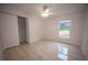 Cozy bedroom with closet space, neutral paint, and a window providing natural light at 2258 Cr 423, Lake Panasoffkee, FL 33538