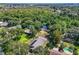 Aerial view of home with solar panels and a tranquil waterfront setting at 28432 Tammi Dr, Tavares, FL 32778