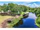 Waterfront property with boat dock and lush landscaping at 28432 Tammi Dr, Tavares, FL 32778