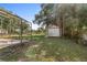 Large backyard with detached shed and mature trees at 28432 Tammi Dr, Tavares, FL 32778