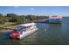 Paddleboat docked near waterfront buildings at 28432 Tammi Dr, Tavares, FL 32778