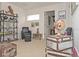 Cozy bonus room with stylish decor, including unique furniture and decorative items on the shelves at 436 Orange Cosmos Blvd, Davenport, FL 33837
