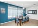 Bright dining room with a modern light fixture and seating for eight at 436 Orange Cosmos Blvd, Davenport, FL 33837