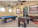 Recreation room featuring a pool table and foosball table, perfect for leisure and entertainment at 436 Orange Cosmos Blvd, Davenport, FL 33837