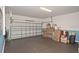 Spacious two car garage with painted floor, a utility sink and painted walls at 436 Orange Cosmos Blvd, Davenport, FL 33837