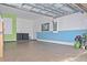Spacious two car garage with painted floor, a utility sink and painted walls at 436 Orange Cosmos Blvd, Davenport, FL 33837