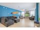 Bright living room with contemporary furnishings and access to outdoor space at 436 Orange Cosmos Blvd, Davenport, FL 33837