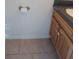 Close-up of bathroom vanity and tile flooring at 8590 Se 157Th Pl, Summerfield, FL 34491