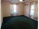 Bedroom with carpet and window with curtains at 8590 Se 157Th Pl, Summerfield, FL 34491