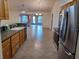 Kitchen with wood cabinets and tile floor at 8590 Se 157Th Pl, Summerfield, FL 34491