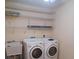 Laundry room with washer, dryer, and utility sink at 8590 Se 157Th Pl, Summerfield, FL 34491