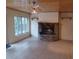 Living room with stone fireplace and wood ceiling at 8590 Se 157Th Pl, Summerfield, FL 34491