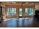 Bright living room with tiled flooring, wood ceilings and large windows offering natural light at 8590 Se 157Th Pl, Summerfield, FL 34491