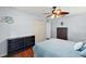 Comfortable bedroom with wood flooring and a ceiling fan for added comfort at 1039 Sandhill St, Groveland, FL 34736